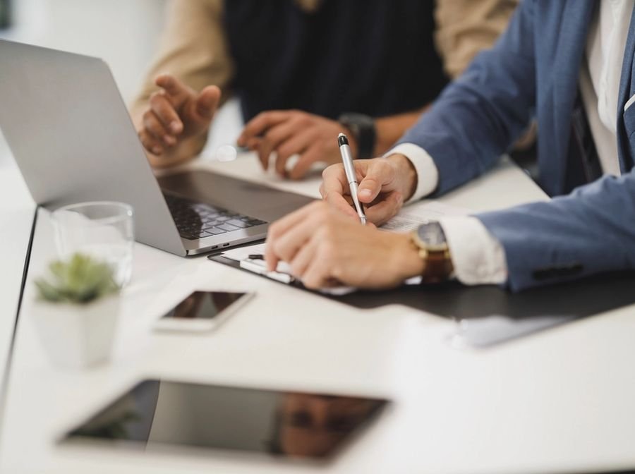 Advisor and client reviewing and signing documents