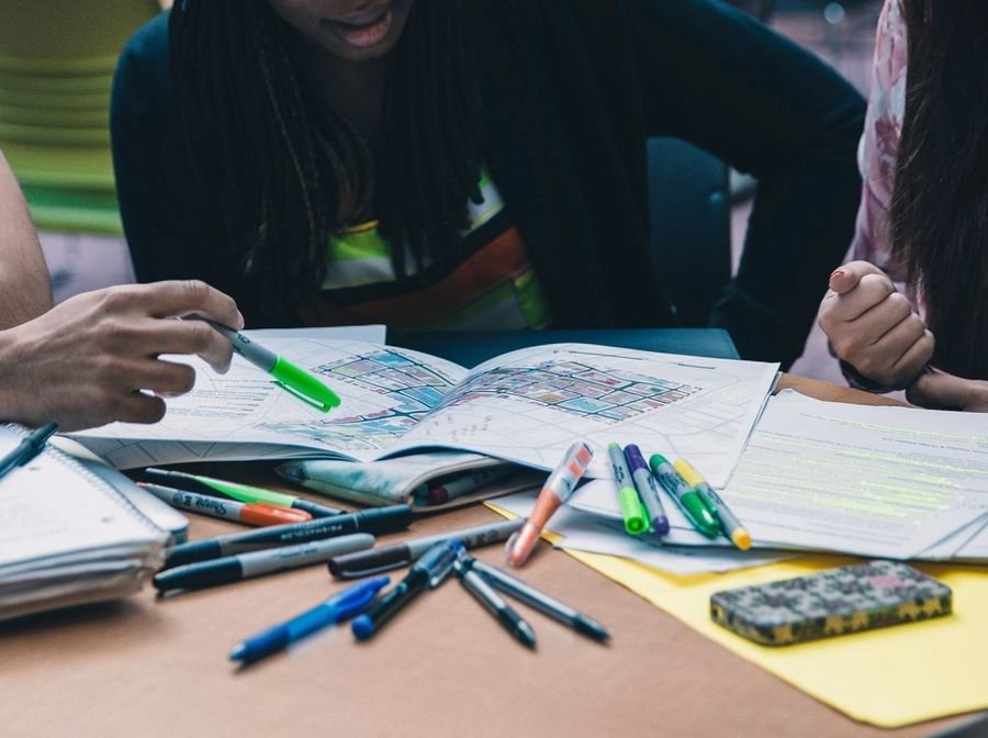 Students with notebooks and highlighters